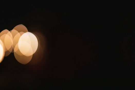 Abstract bokeh backdrop of multiplying lights in evening
