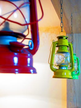 Vibrant red and green vintage lanterns hanging indoors, creating a warm and nostalgic atmosphere.