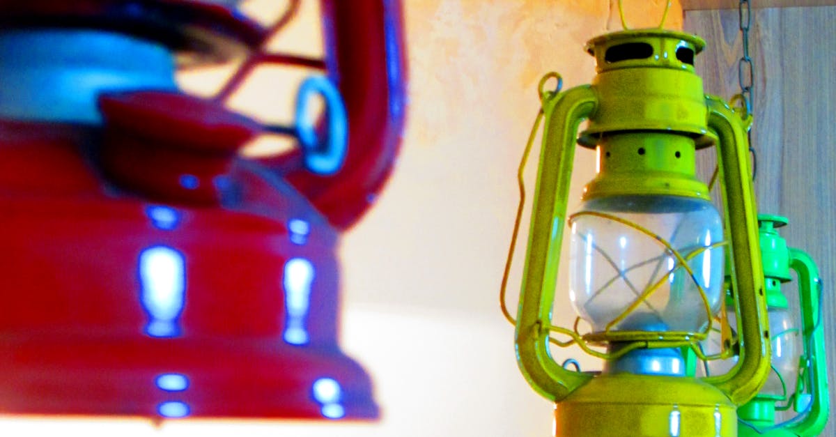Three Red, Yellow, and Green Gas Lantern Hanging on Ceiling