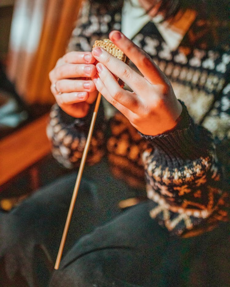 Crop Woman Preparing Smore On Stick In Twilight