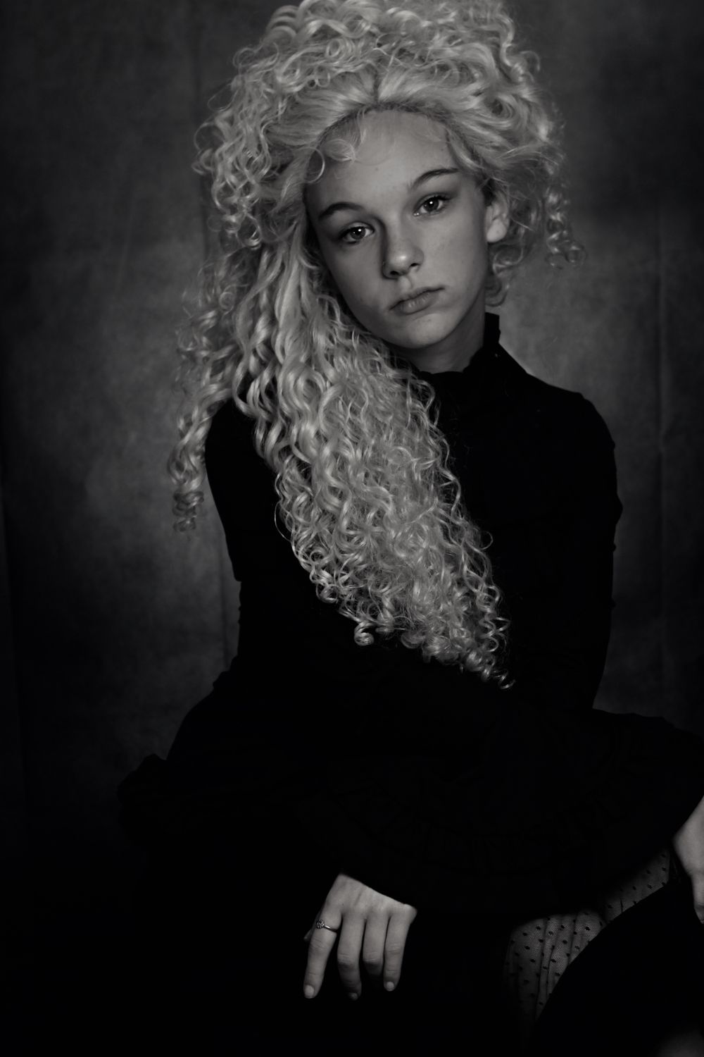 Black and White Photo of a Woman with Curly Hair · Free Stock Photo