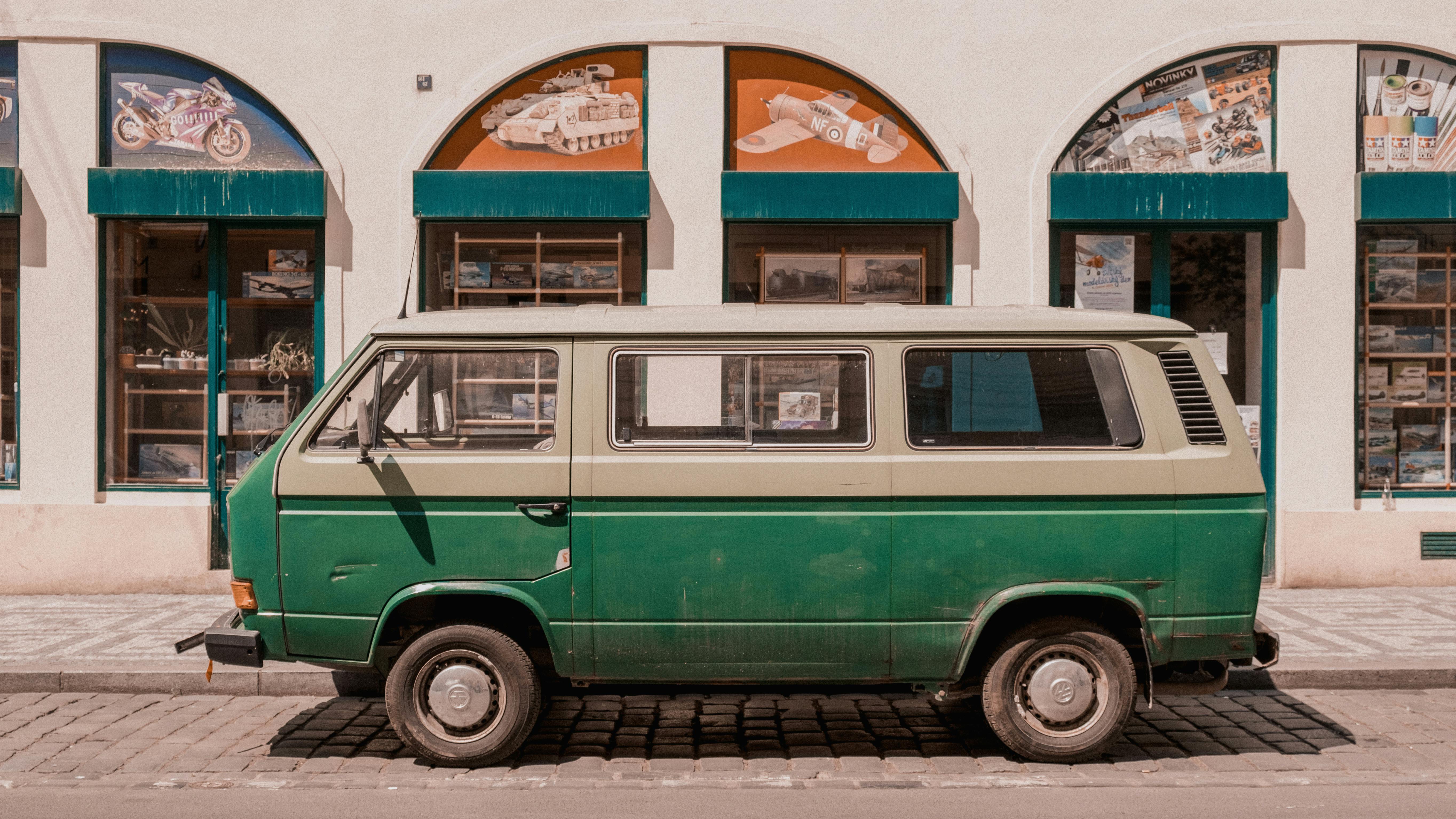 green van parked on the road