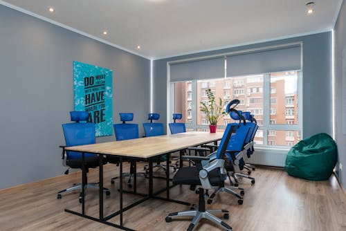 Table with armchairs in conference room