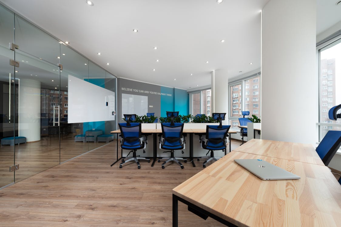 board room with blue chairs and aluminum glass doors