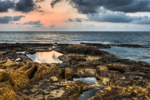 Scenic View of the Rocky Shore and the Horizon