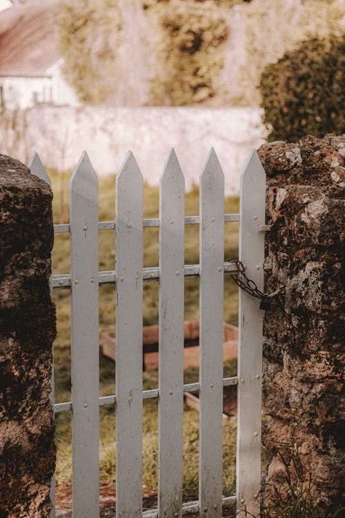 Old gate between stone walls in countryside