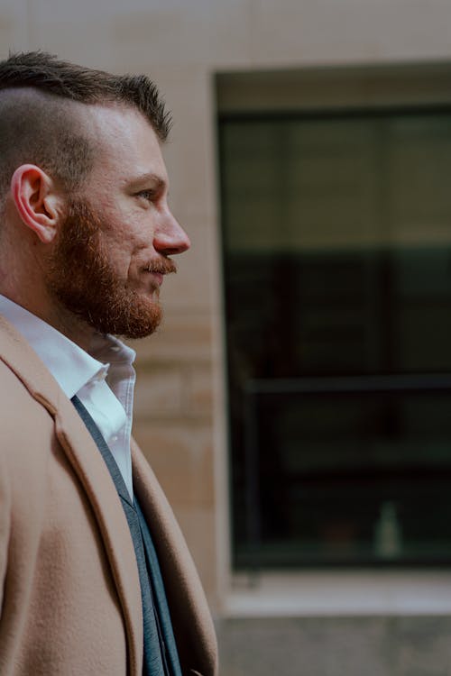 Free Side View of a Man in Brown Suit Jacket Stock Photo