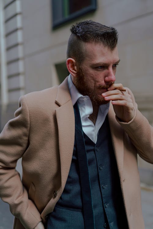 Free Man in Brown Suit Jacket Smoking Cigarette Stock Photo