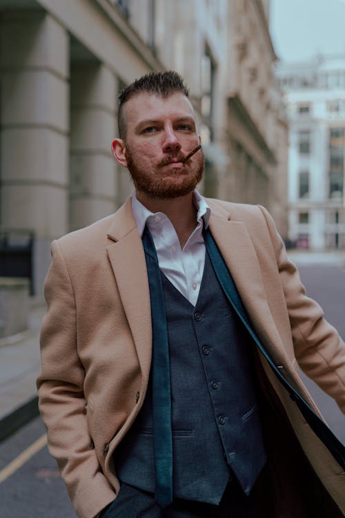 Man in Brown Suit Jacket Standing Near Building