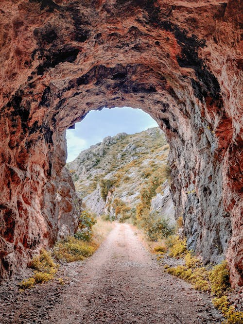 Free Light at the End of a Rock tunnel Stock Photo