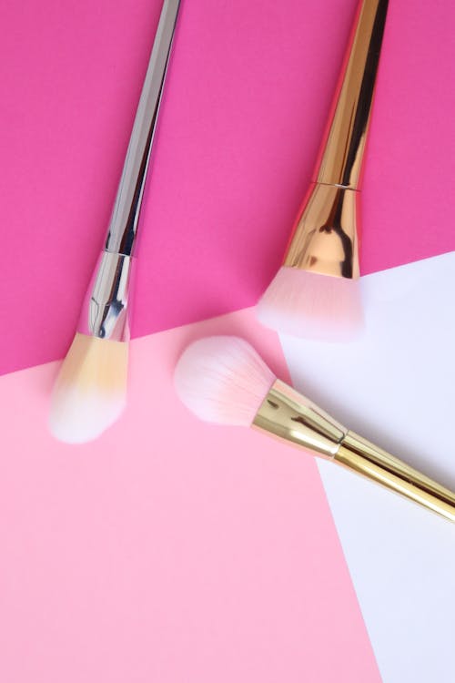 Free Makeup Brush Set over a Pink Surface Stock Photo