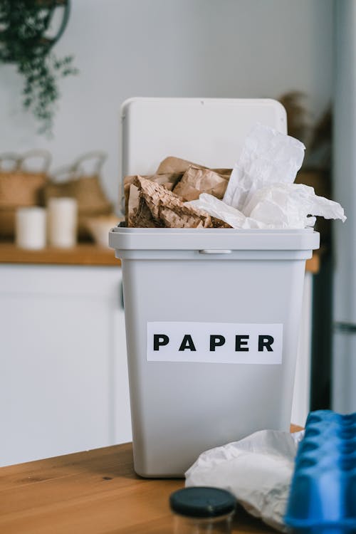 Plastic container for paper on table