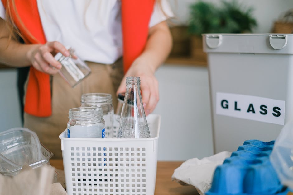 Woman selecting glass into plastic container