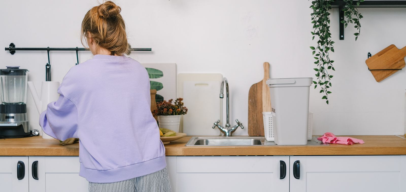 Woman at the counter in a bright kitchen