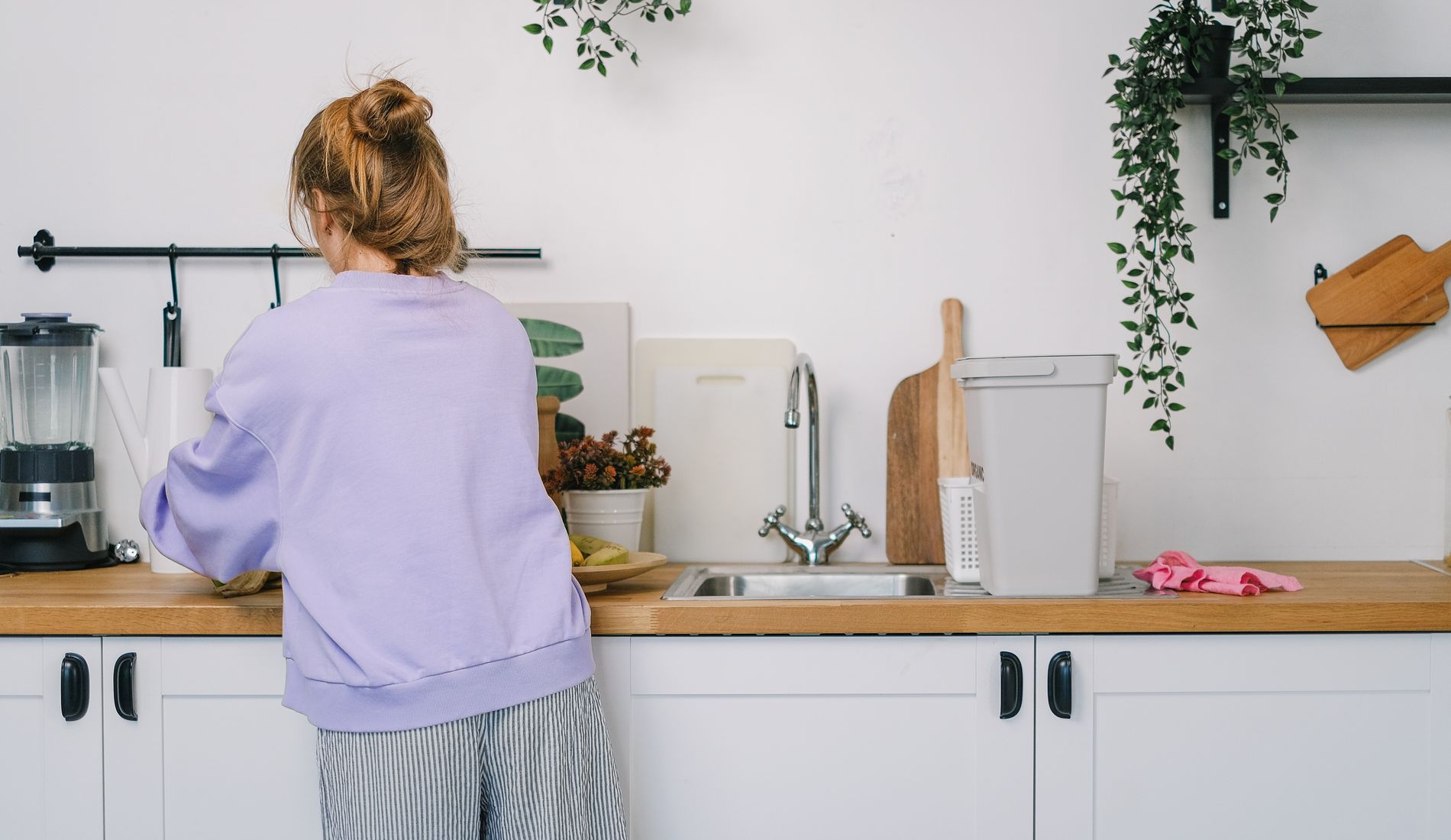 Woman at the counter in a bright kitchen