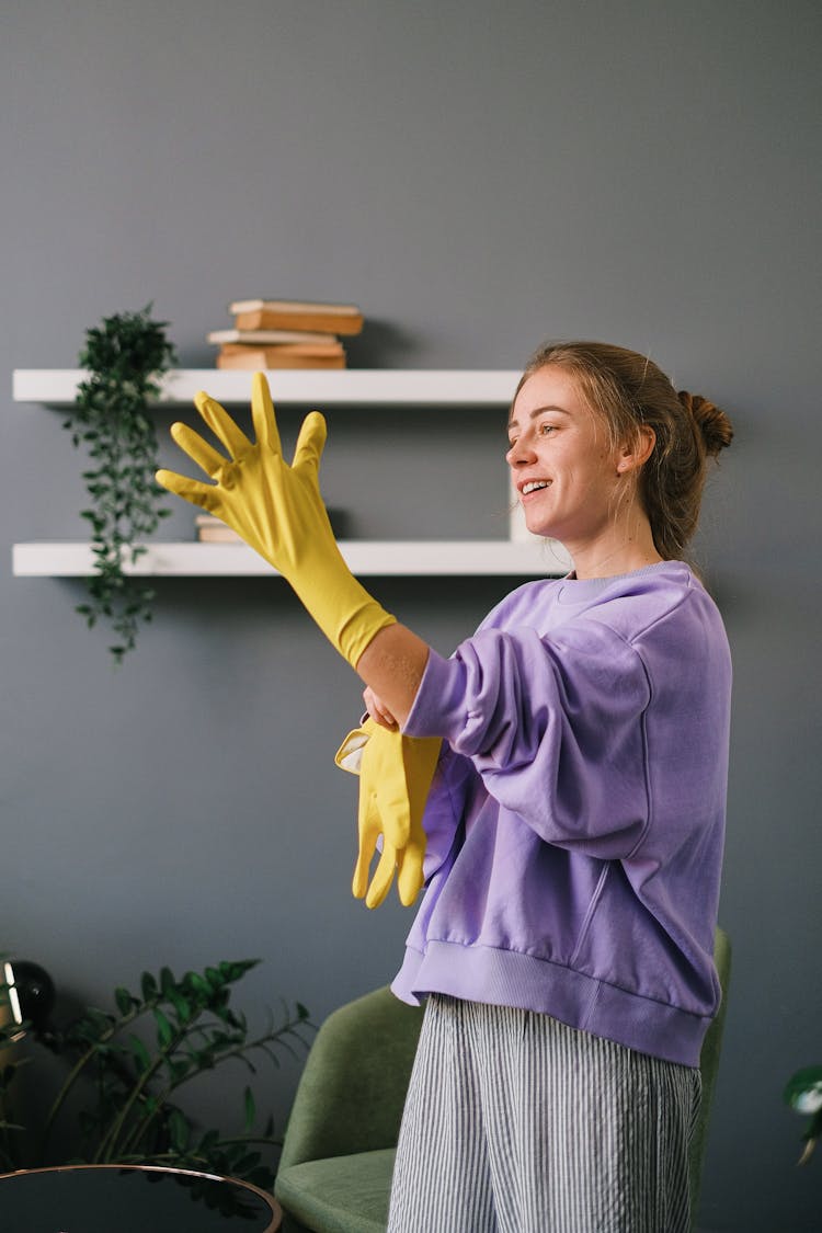 Woman Putting On Gloves