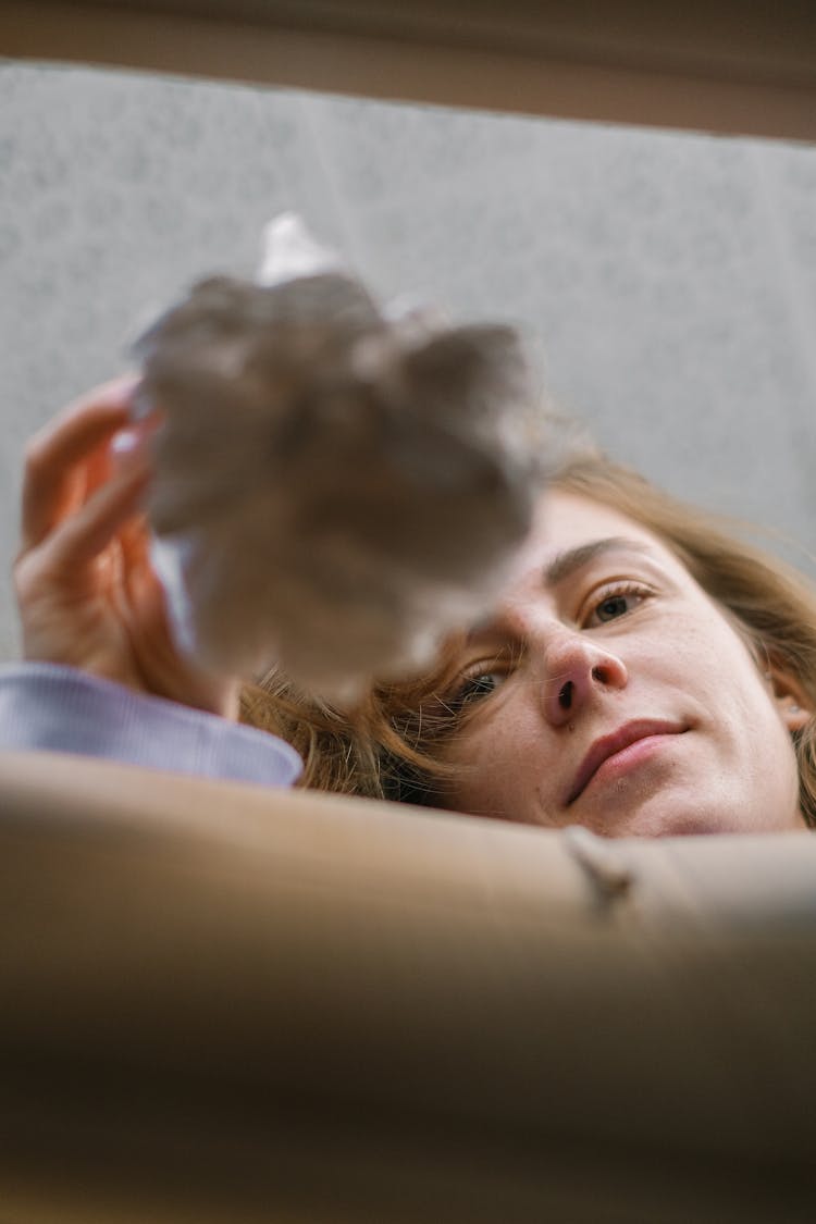 Calm Woman Taking Toy Out Of Box