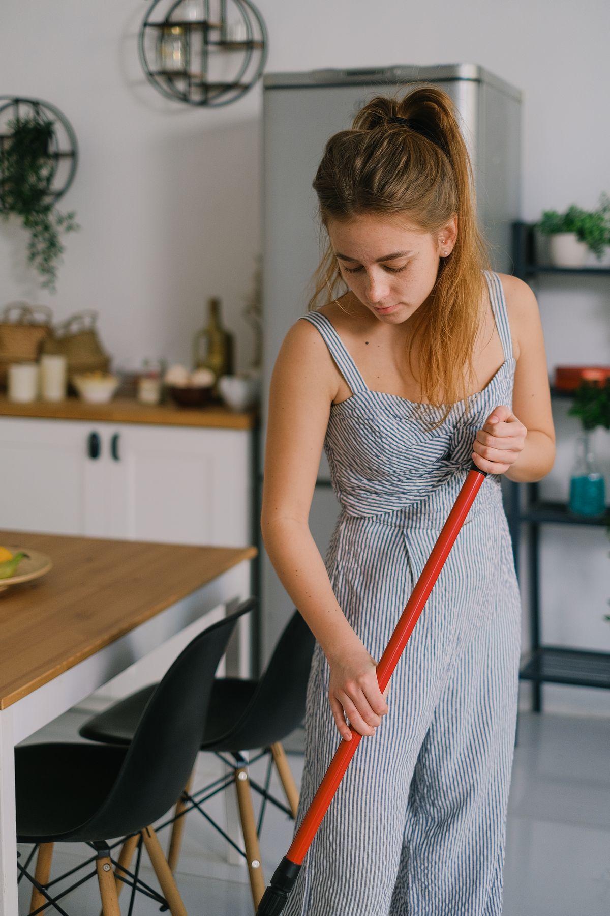 Wiping up a spill on a waterproof laminate kitchen floor