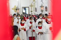 Altar servers in a religious procession at a church in Vitória de Santo Antão, Brazil, during a ceremony.