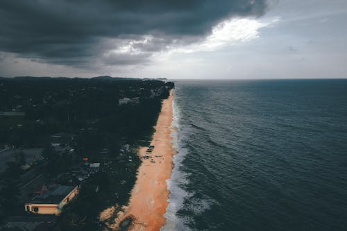 Dramatic sky over ocean and sandy beach