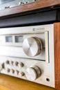 Modern audio power amplifier with control panel at home