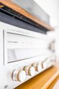 Modern audio power amplifier on table in house