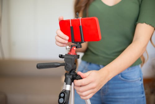 Free Person Holding Red and Black Camera Stock Photo
