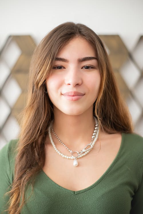 A Woman Wearing Pearl Necklaces