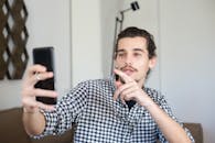 A Man in Checkered Shirt on a Video Call