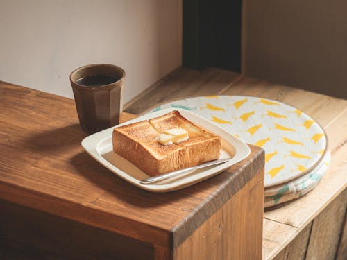 Free Butter on Toast and a Cup of Coffee Stock Photo