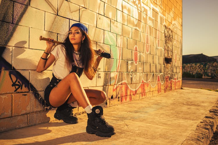 Teenage Girl Holding A Baseball Bat