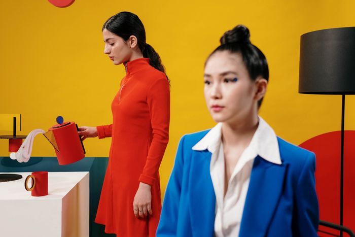 Two people in a colour-blocked set-design studio, photo by cottonbro studio on Pexels