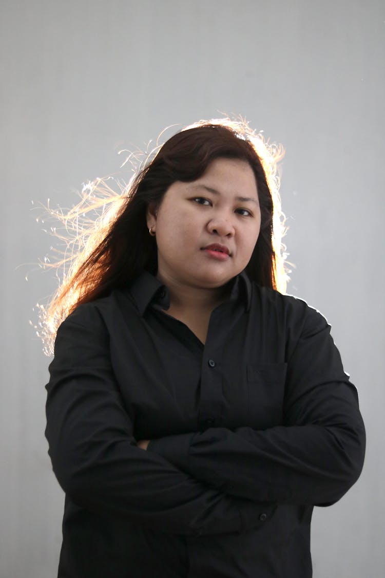 Serious Asian Woman In Black Shirt