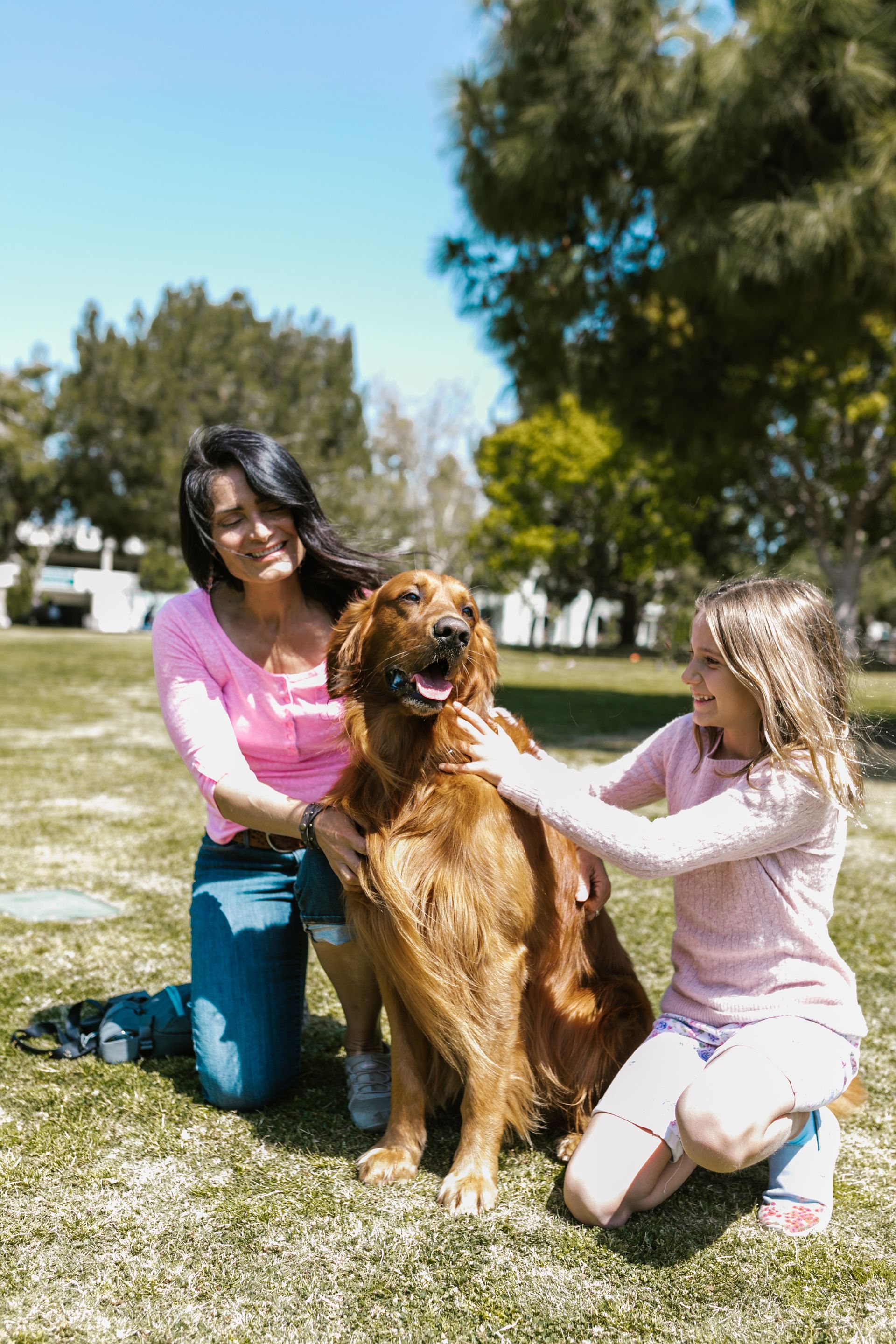 Family with dog in park