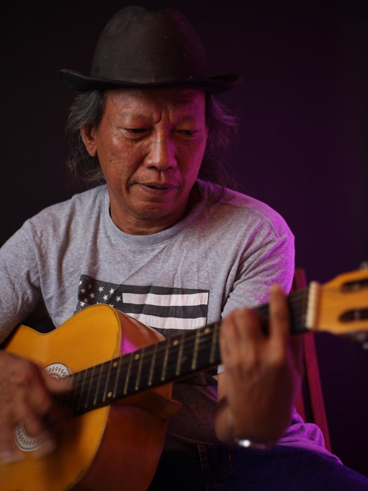 Senior Native American Man Playing Guitar