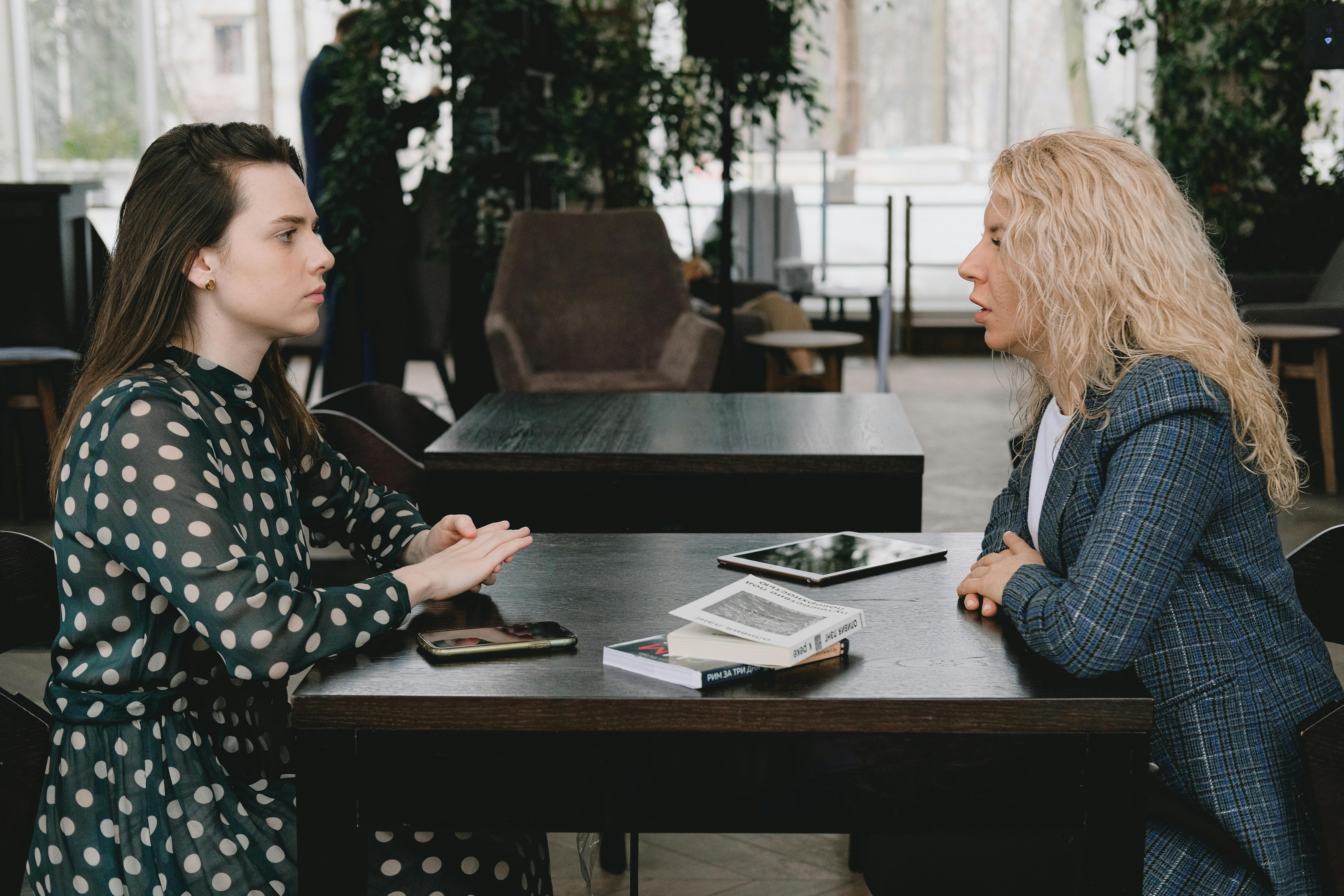 female colleagues having serious talk