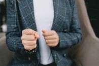 Anonymous elegant lady showing fist to camera