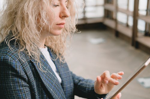 Woman Wearing a Coat Using a Smartphone