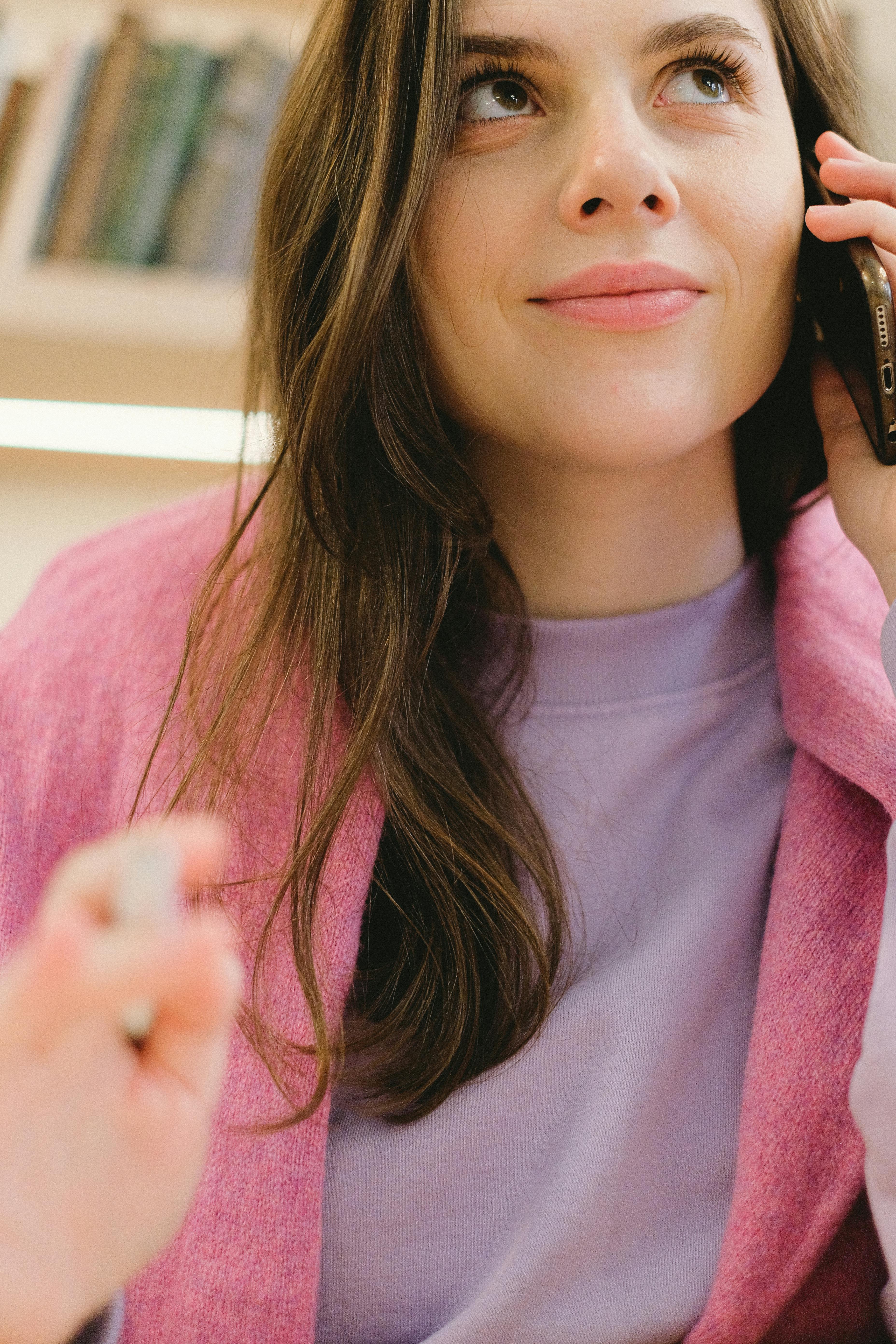 lady speaking on smartphone in library