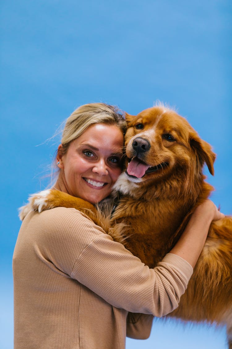 Woman Hugging A Dog