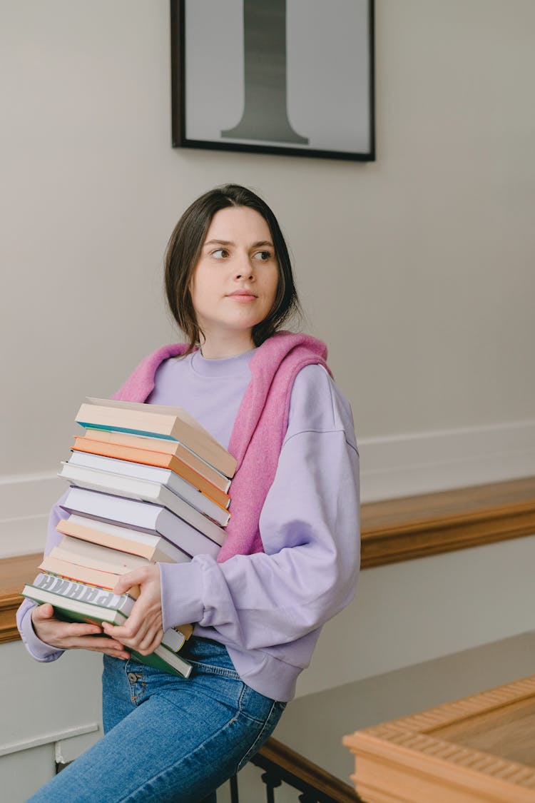 Woman Carrying Books