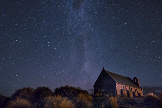 Night view of Church of the Good Shepherd with a stunning starry sky at Lake Tekapo, New Zealand.