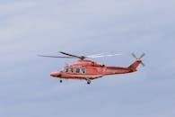 Red Helicopter Flying in the Sky