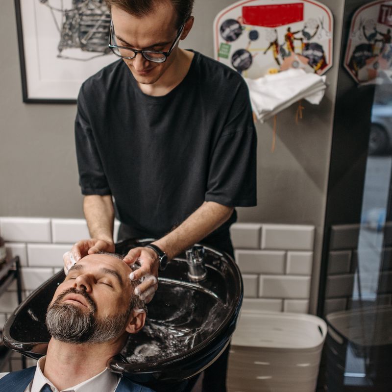 Hair being washed at a salon basin