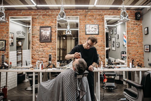 A Man Cutting a Hair