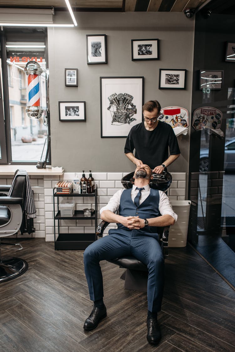 A Man Shampooing His Customer