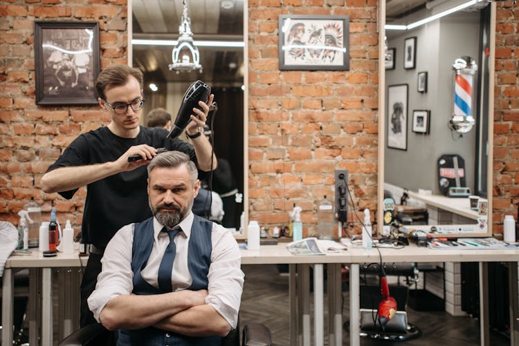 A Barber Doing Hairstyle