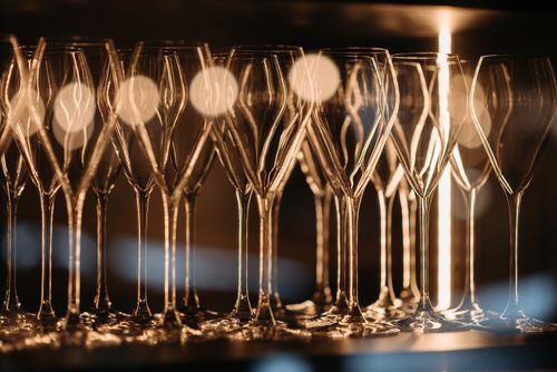 Free A stylish arrangement of empty wineglasses under soft lighting, ideal for restaurant themes. Stock Photo