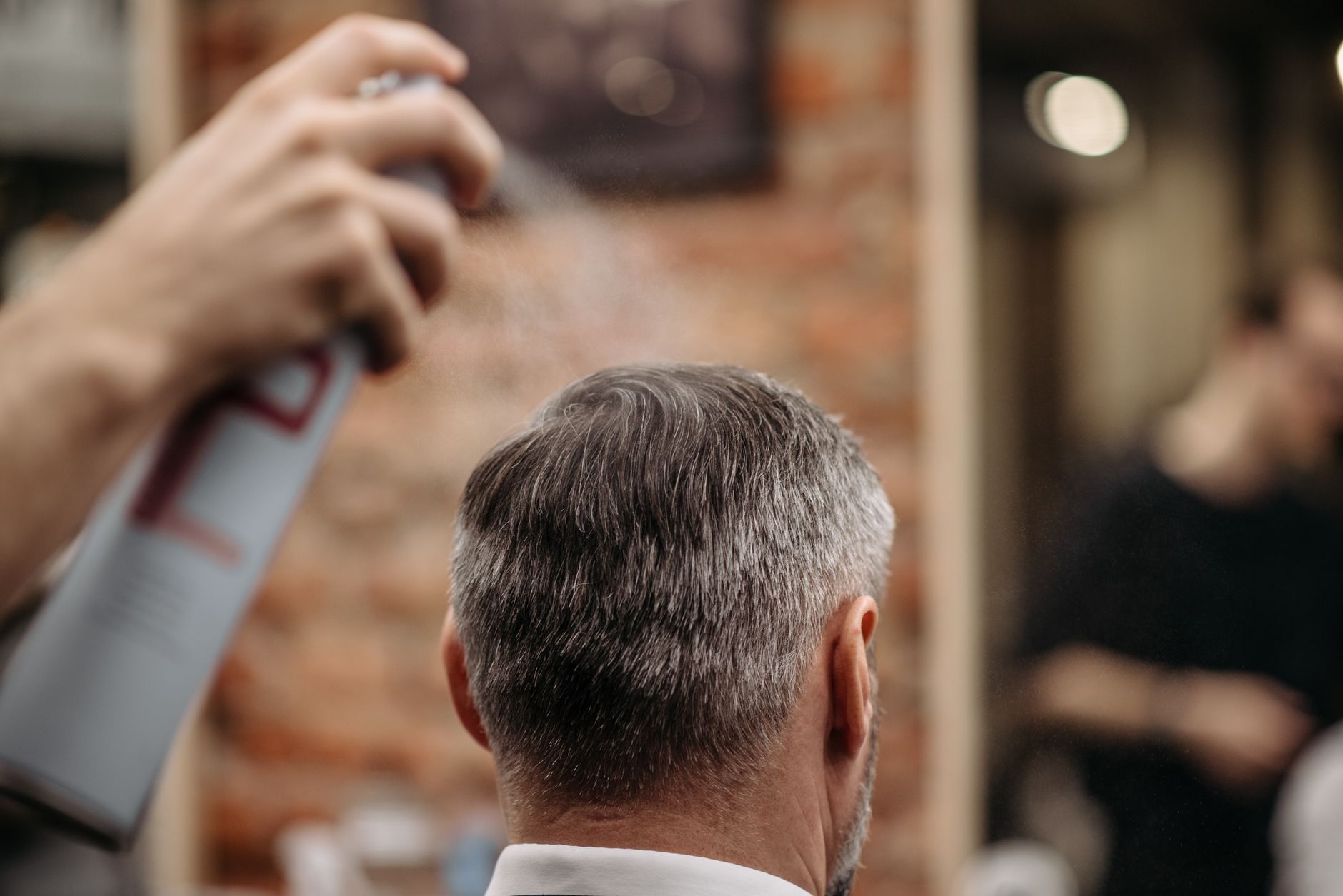 https://www.pexels.com/photo/man-in-white-dress-shirt-holding-white-and-red-plastic-tube-7518763/
