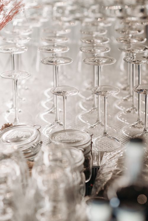 Free Upside down wine glasses create a stunning visual pattern. Ideal for bar or event imagery. Stock Photo